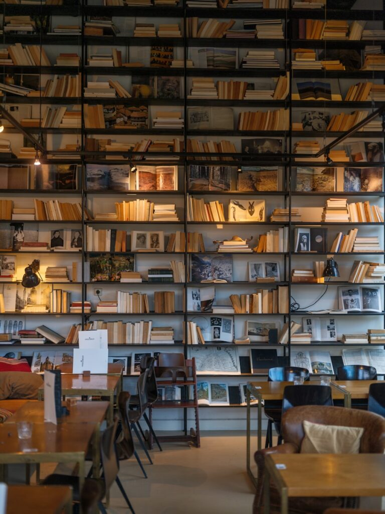 A room filled with lots of books on shelves